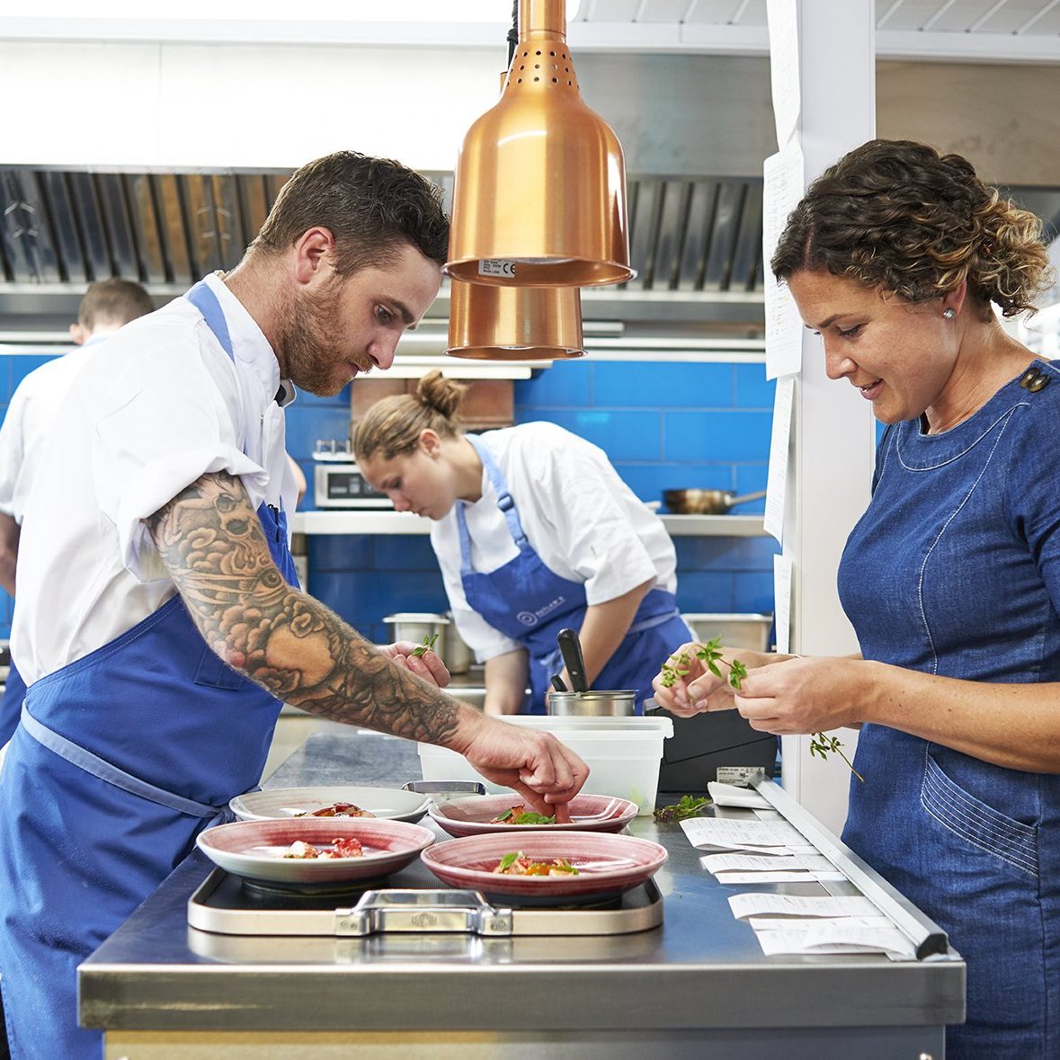 Young chefs working in a kitchen - Careers with Nathan Outlaw